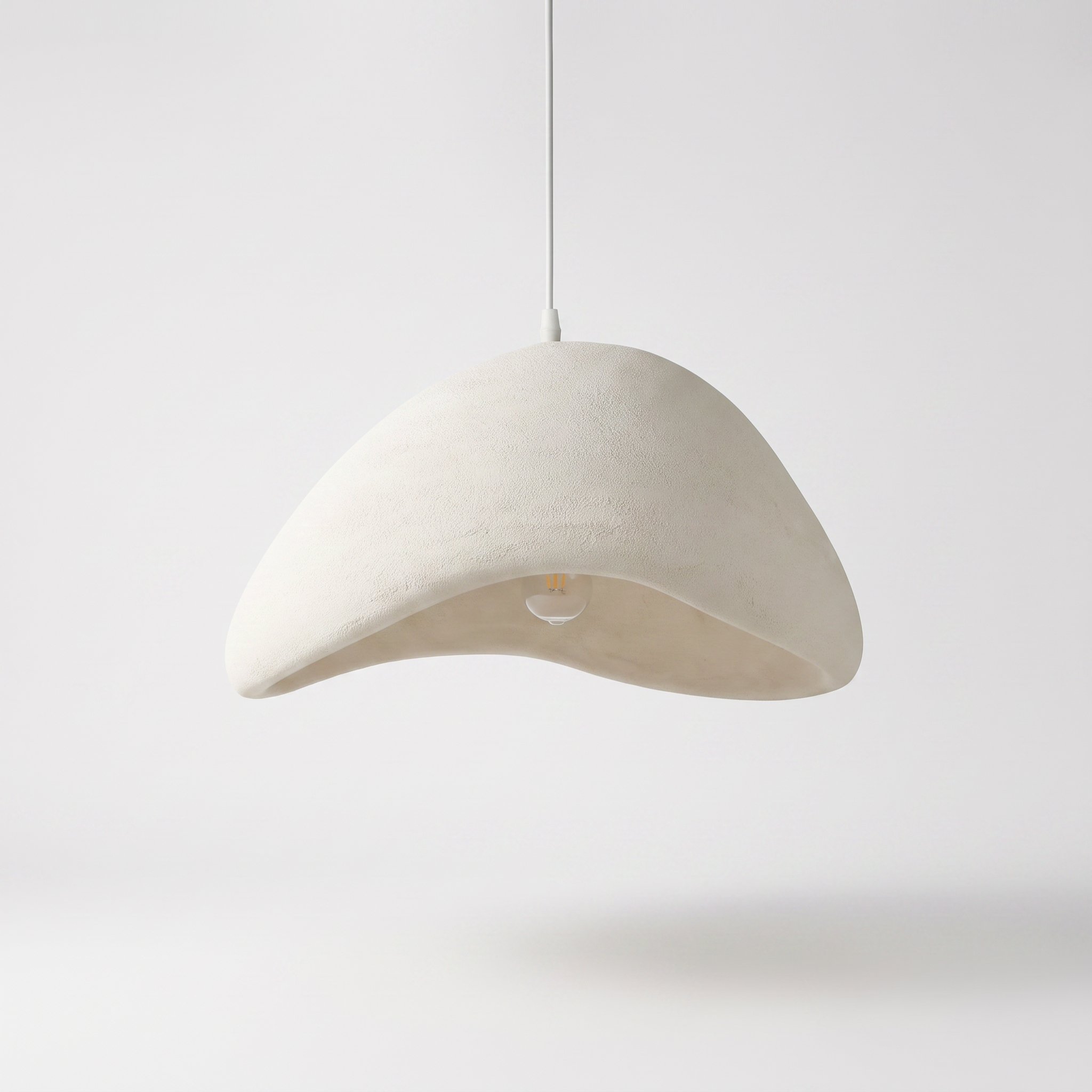 Uluwatu resin pendant light on a plain white background