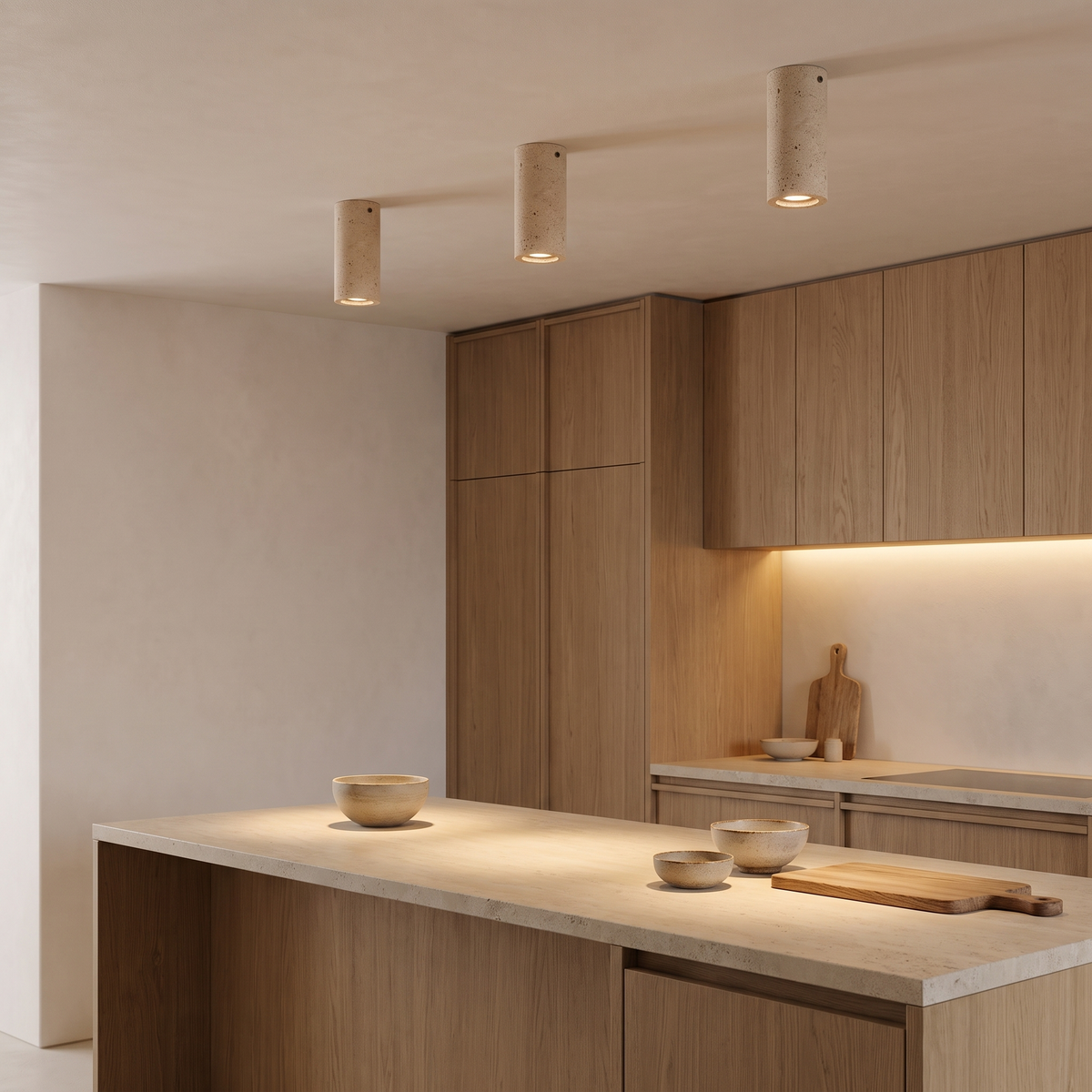 Amon travertine ceiling light in small, three over an oak kitchen island in a Japandi kitchen