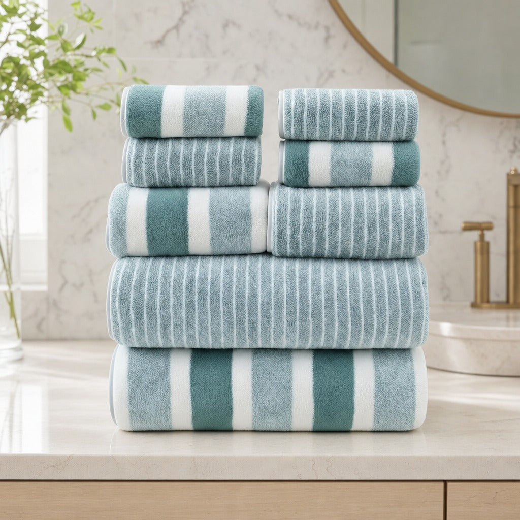 Aurelia 8-piece microfibre towel set in green stripes stacked on a white bathroom vanity