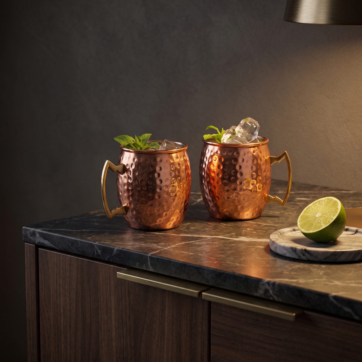 Azar Hammered Copper Moscow Mule Mugs on a marble-topped walnut bar cabinet in warm evening lamplight