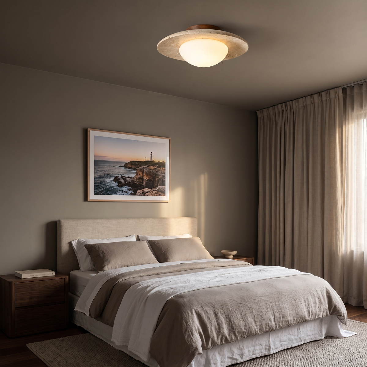 Bali travertine semi-flush ceiling light in a main bedroom with a linen headboard and walnut bedside tables