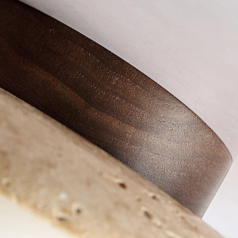 Detail of the Bali travertine ceiling light showing the natural stone saucer shade and opal glass globe
