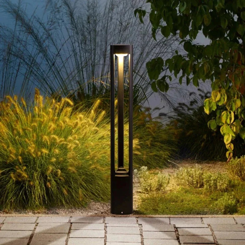 Bella LED Garden Bollard Light styled along a driveway