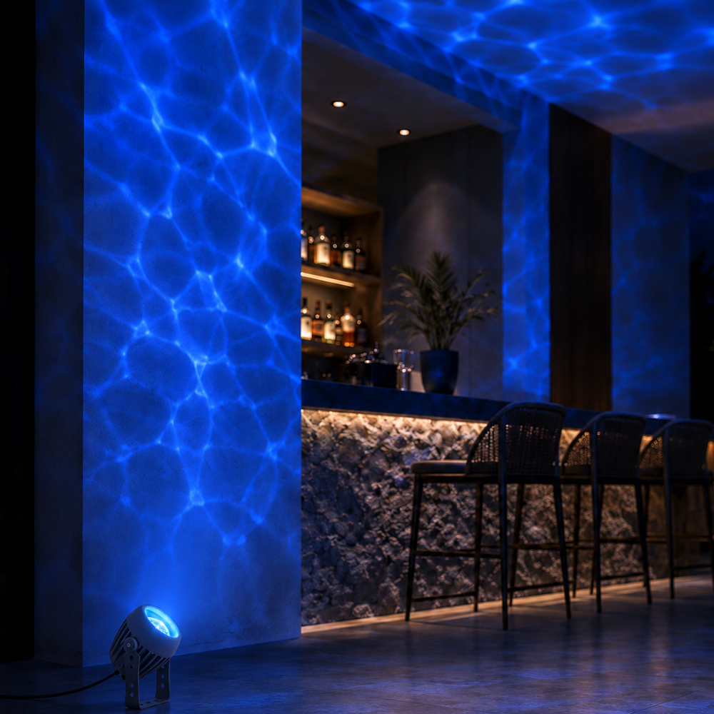 Beso water ripple spotlight casting a blue ripple effect over a bar feature wall
