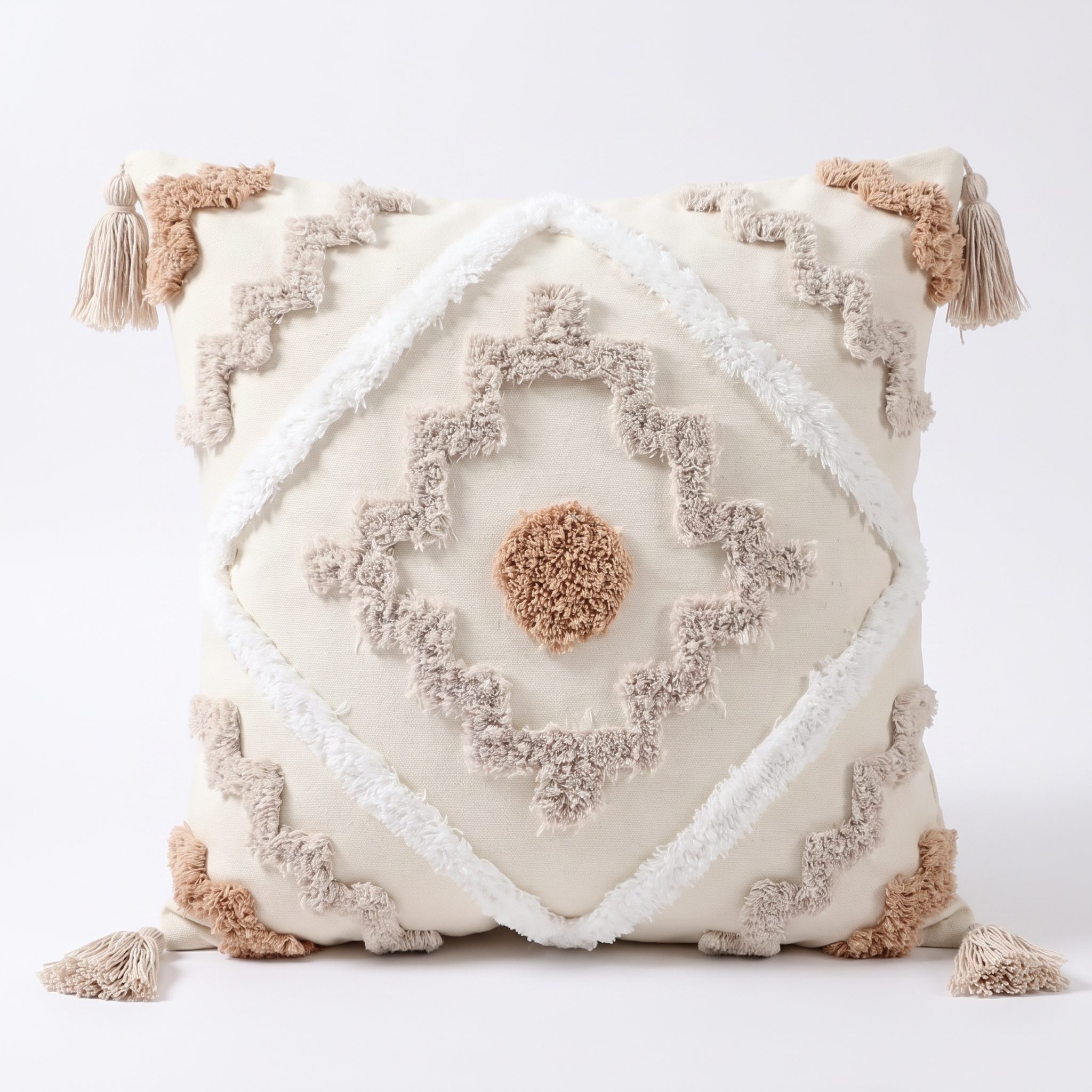 Bilgola tufted geometric cushion cover with tassels on a white background