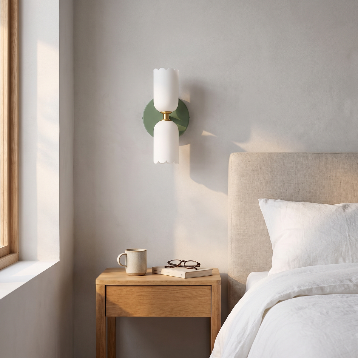 Boni up and down wall light in green in a bedroom