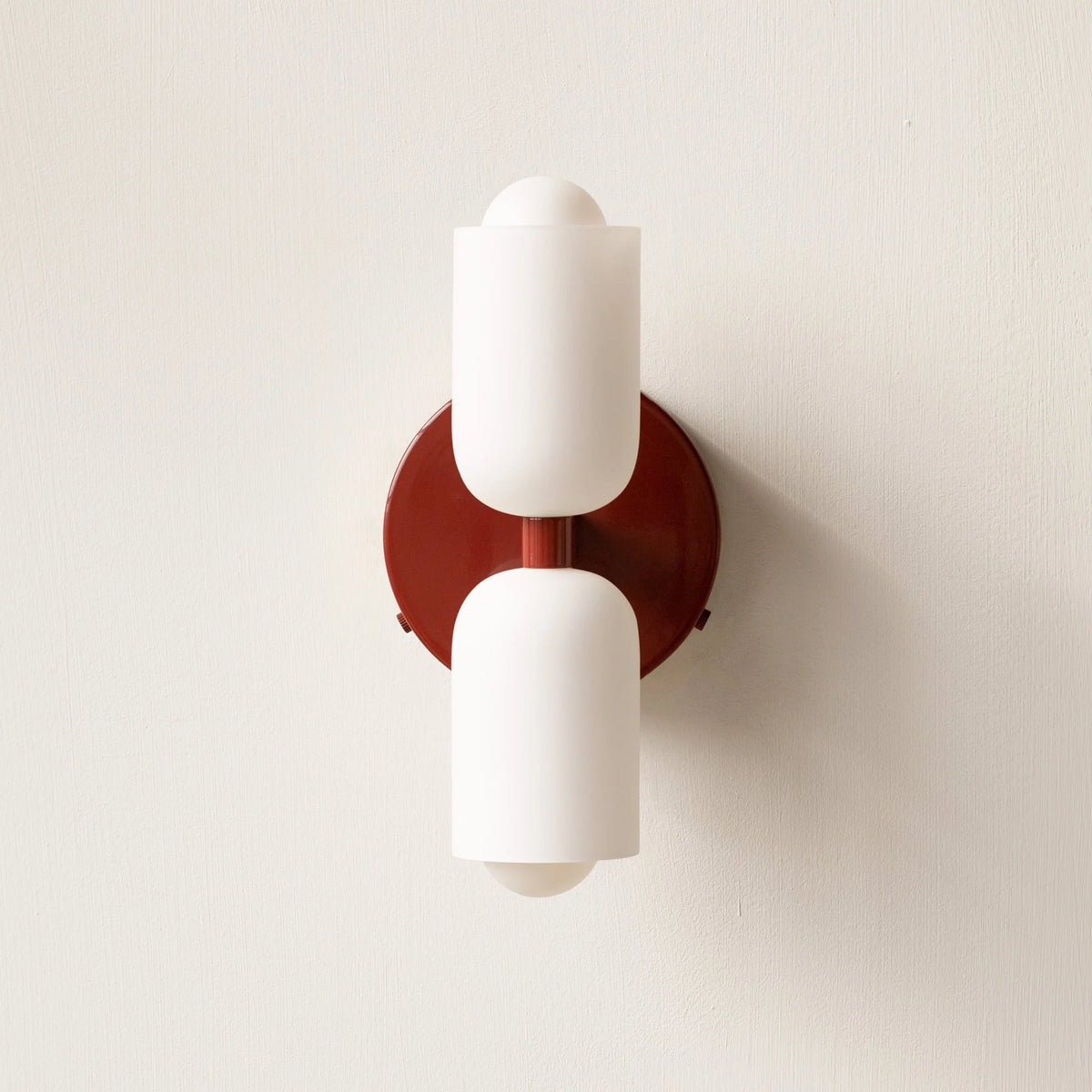 Boni up and down wall light with a red wall plate and two white scalloped opal shades