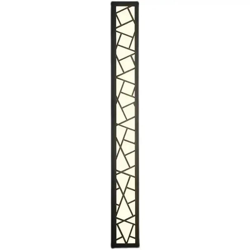 Brawa Stainless Steel LED Outdoor Wall Lamp illuminated at night near a patio