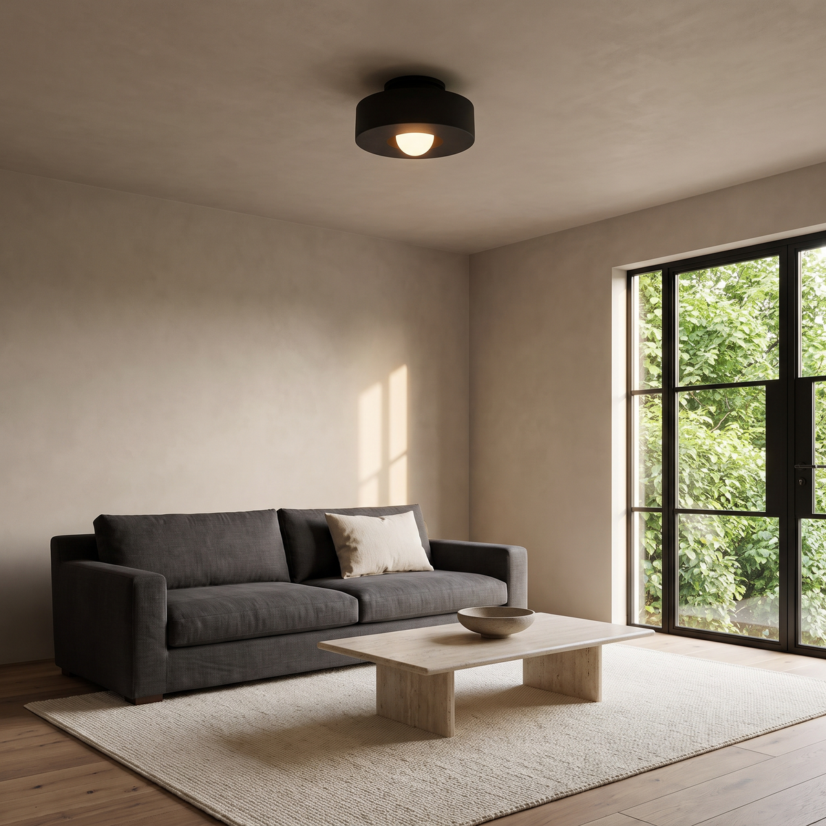 Cami black stepped drum LED ceiling light in a contemporary living room with a charcoal linen sofa