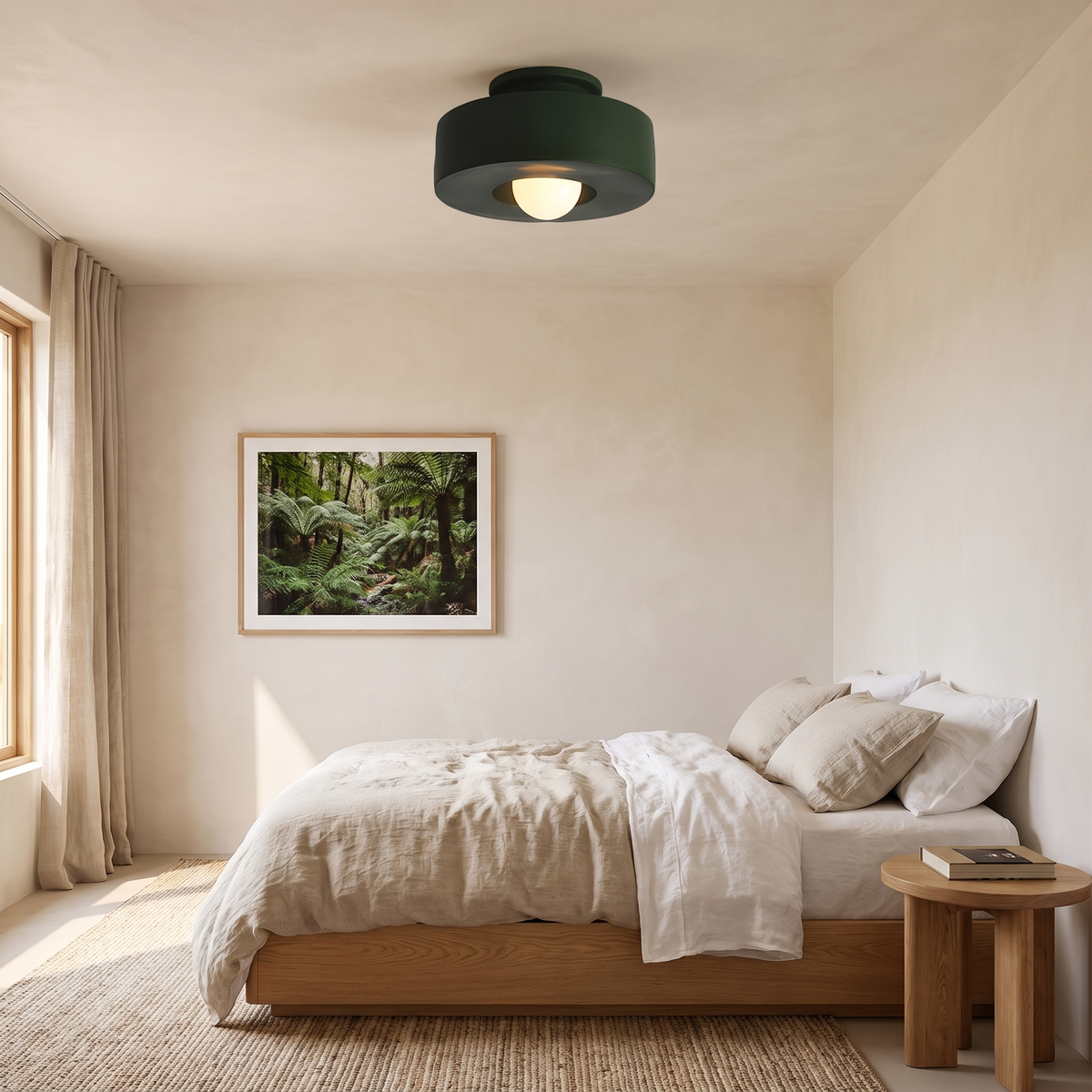 Cami forest green LED ceiling light in a warm bedroom with an oak platform bed