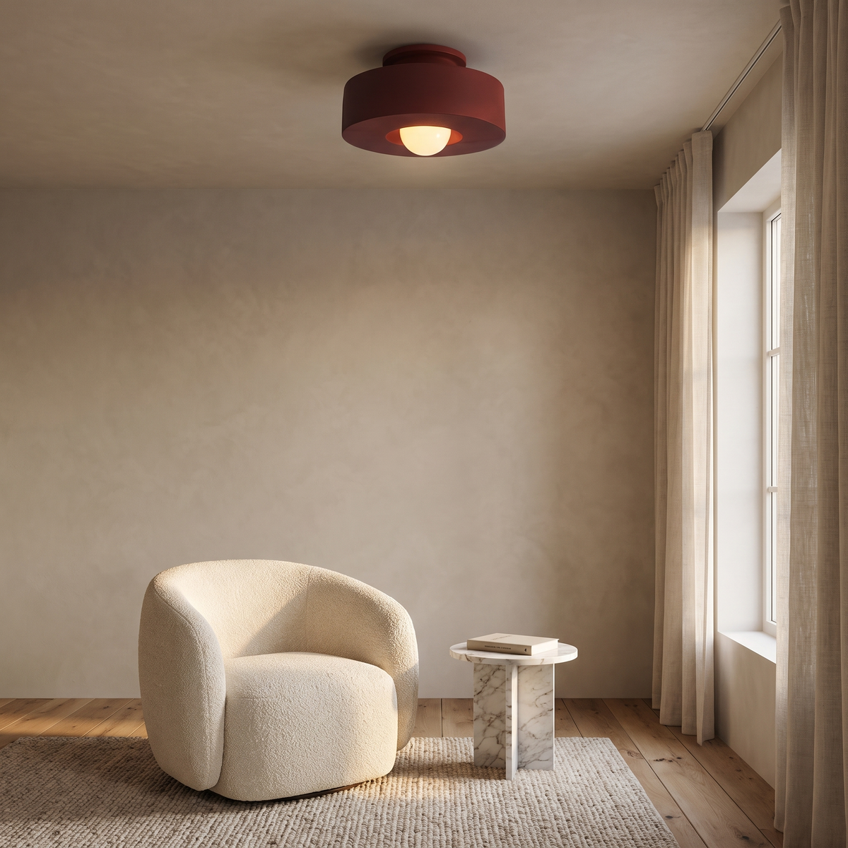 Cami burgundy red LED ceiling light above a reading corner with a boucle armchair and marble side table