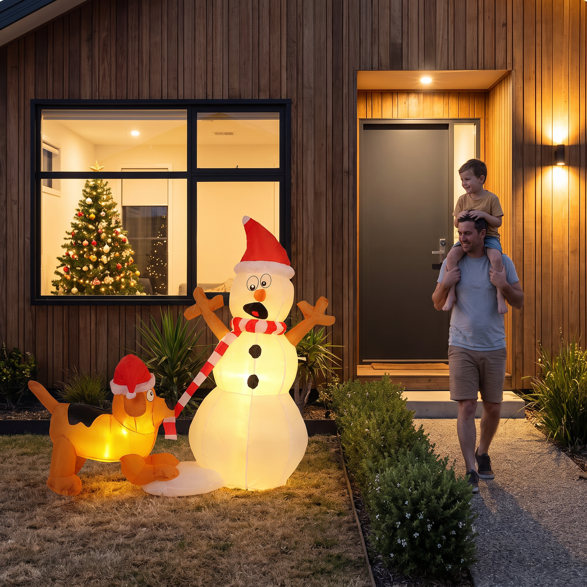 Claus inflatable snowman and dog Christmas decoration lit up in a front yard at night