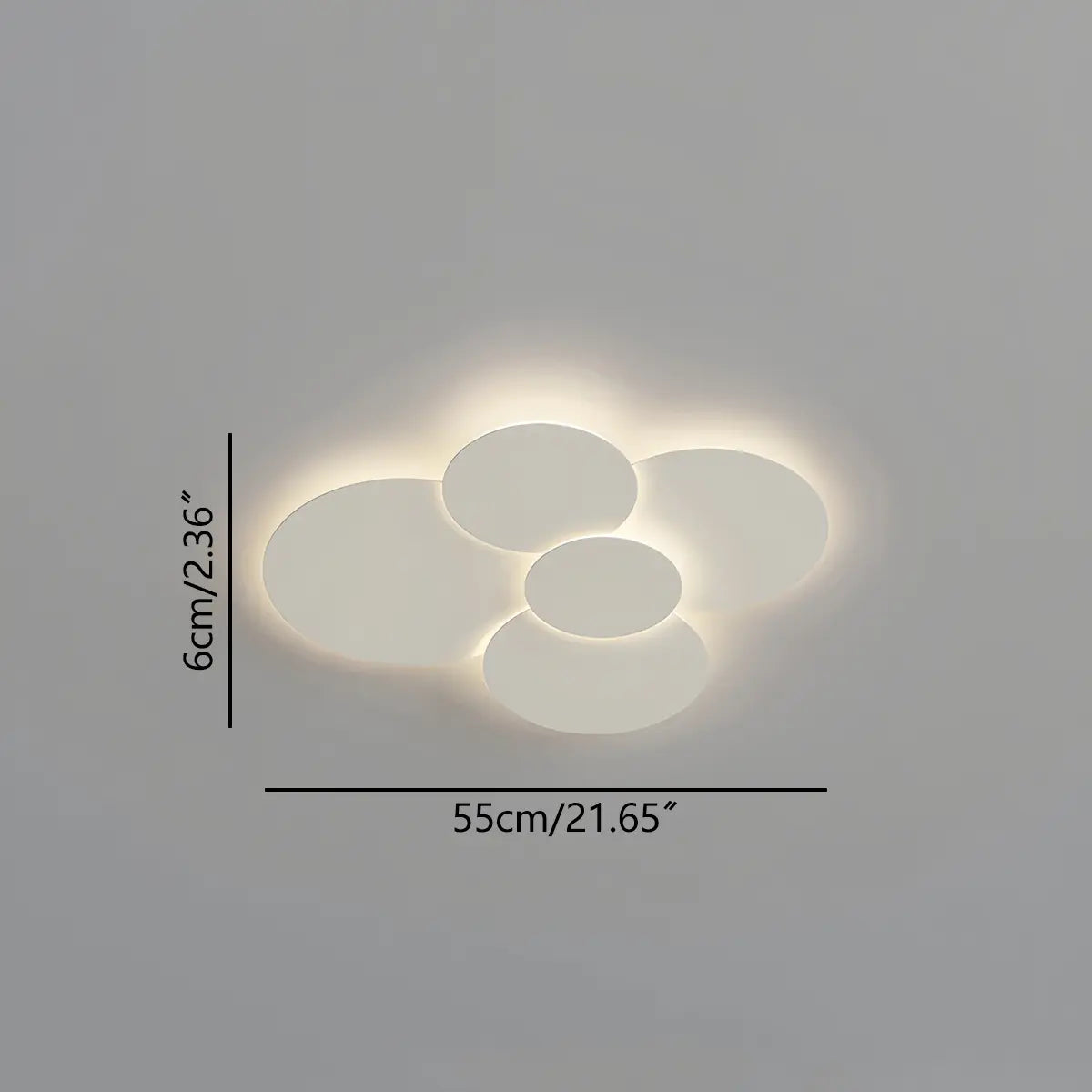 Cloey overlapping disc LED ceiling light glowing warm white against a plain ceiling