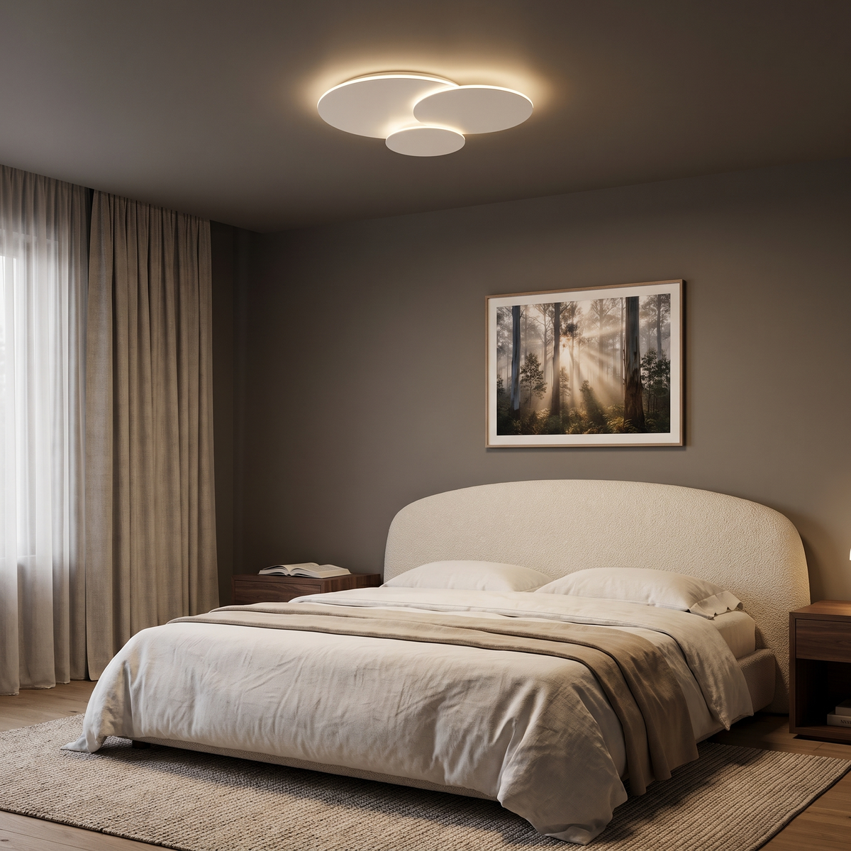 Cloey cloud disc LED ceiling light in a main bedroom with a curved boucle headboard