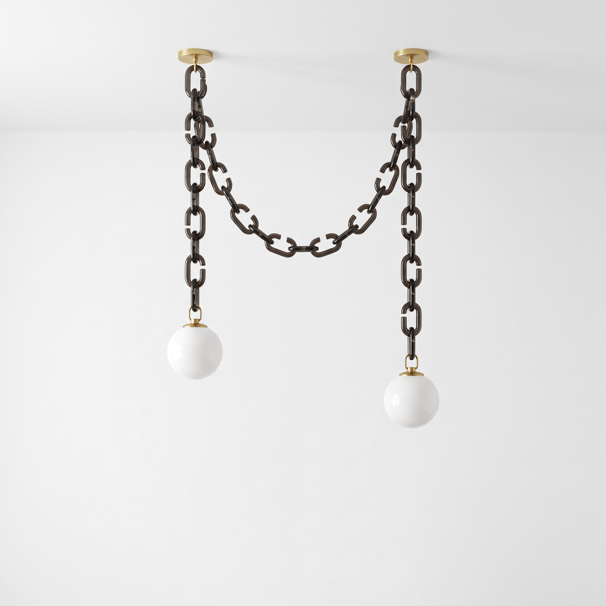 Clove 2-head smoky glass chain pendant light with brass canopies and white globes, on white background