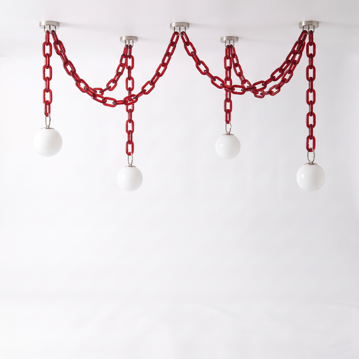 Clove 4-head red glass chain pendant light with white opal globes, on white background