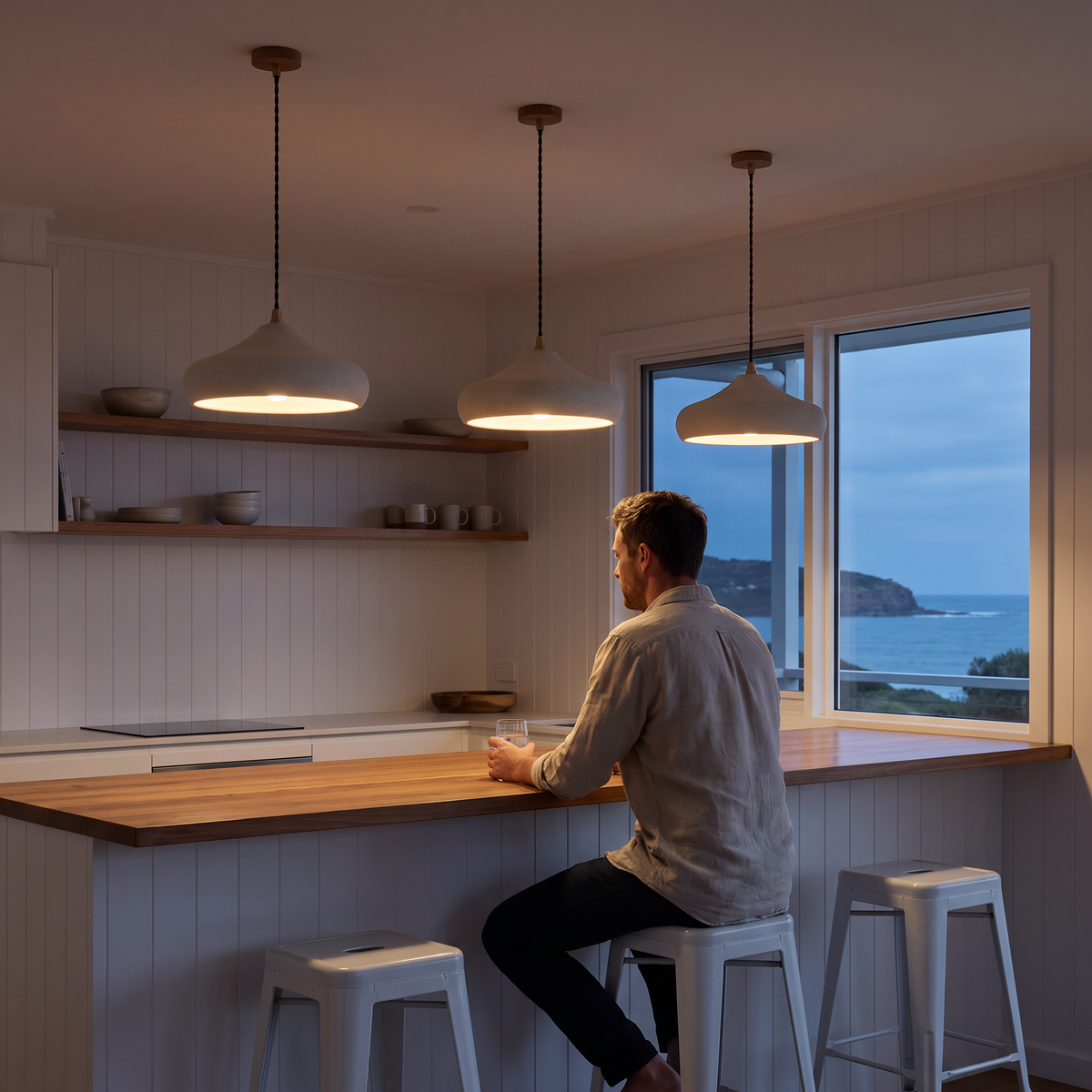 Dakota retro white disc pendant lights over a beach house bar