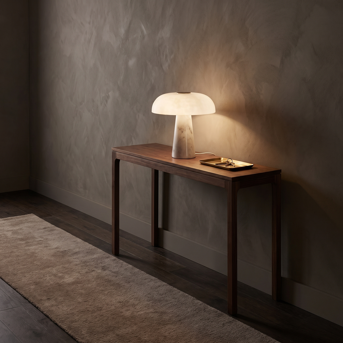 Dover Table Lamp with Marble Base on a walnut console table in an entry hall at dusk