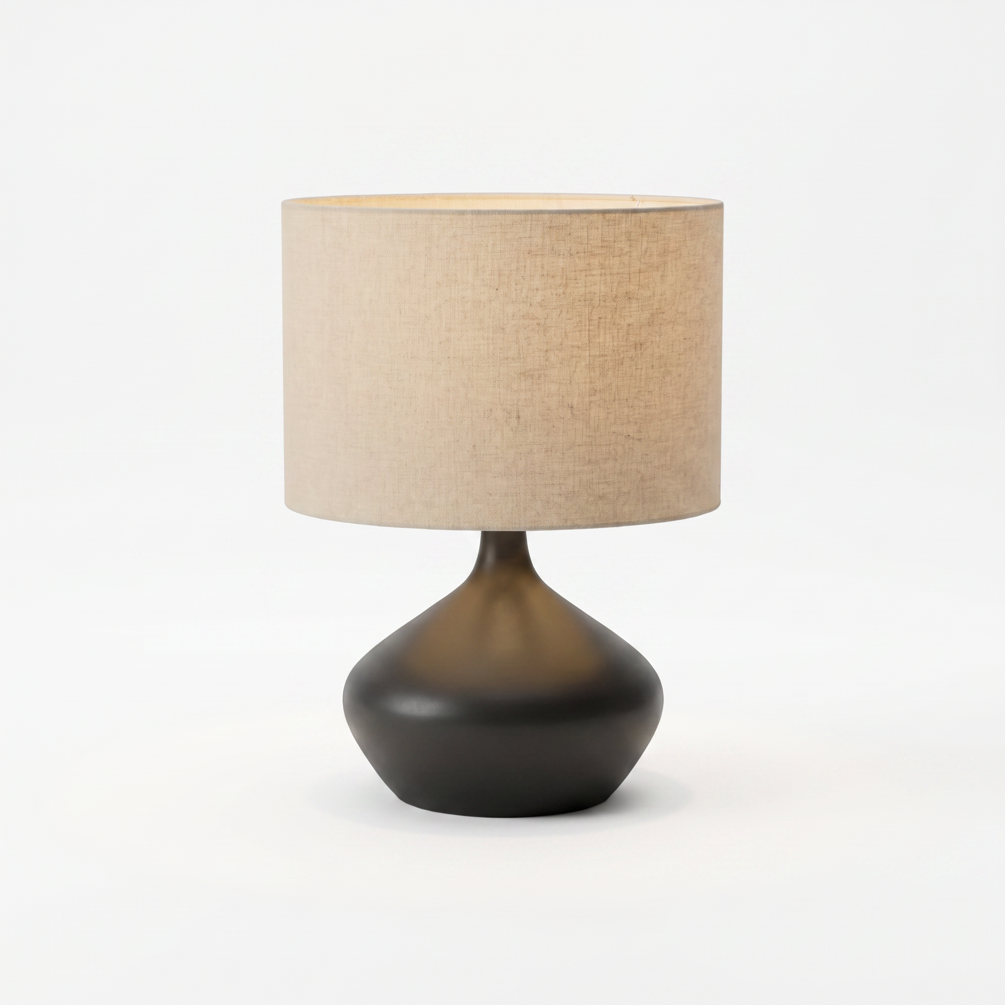 Dune sculptural ceramic table lamp with a natural linen shade on a plain white background