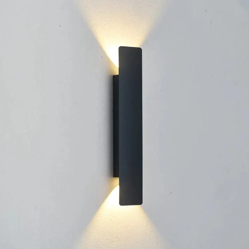 Eli Nordic LED Wall Light mounted on an exterior wall illuminated at night