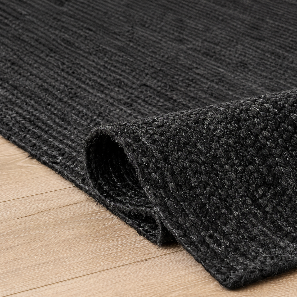 Elvren Jute Rug styled in a living room, showing its natural bohemian look