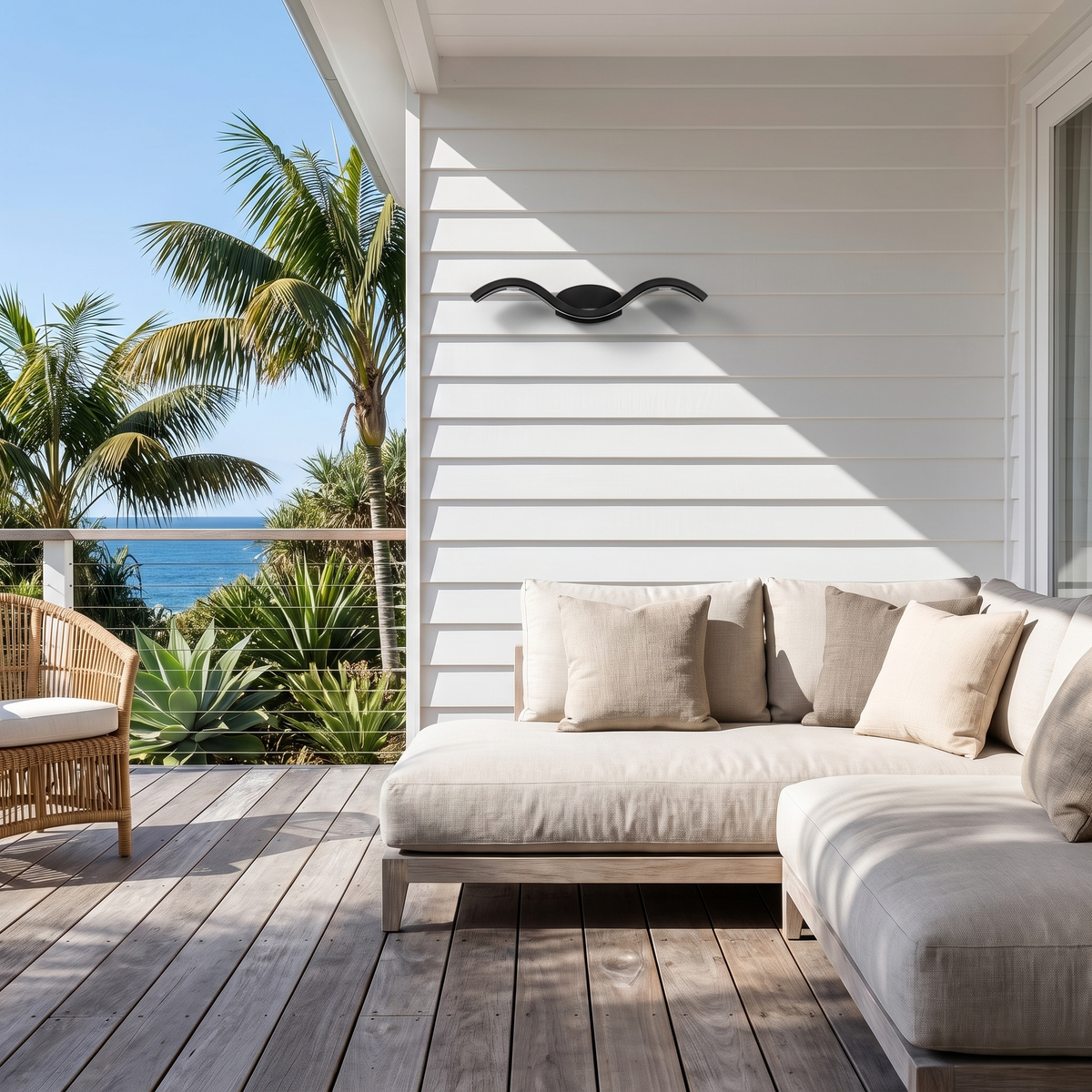 Fly Modern Outdoor Wall Light in black on a white shiplap beach house deck on a sunny morning