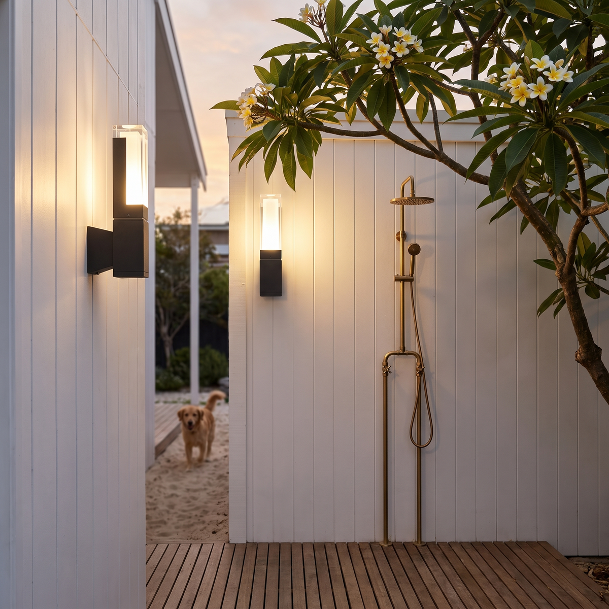 Freo Outdoor Wall Light, 7W, in a shiplap outdoor shower courtyard with frangipani at dusk