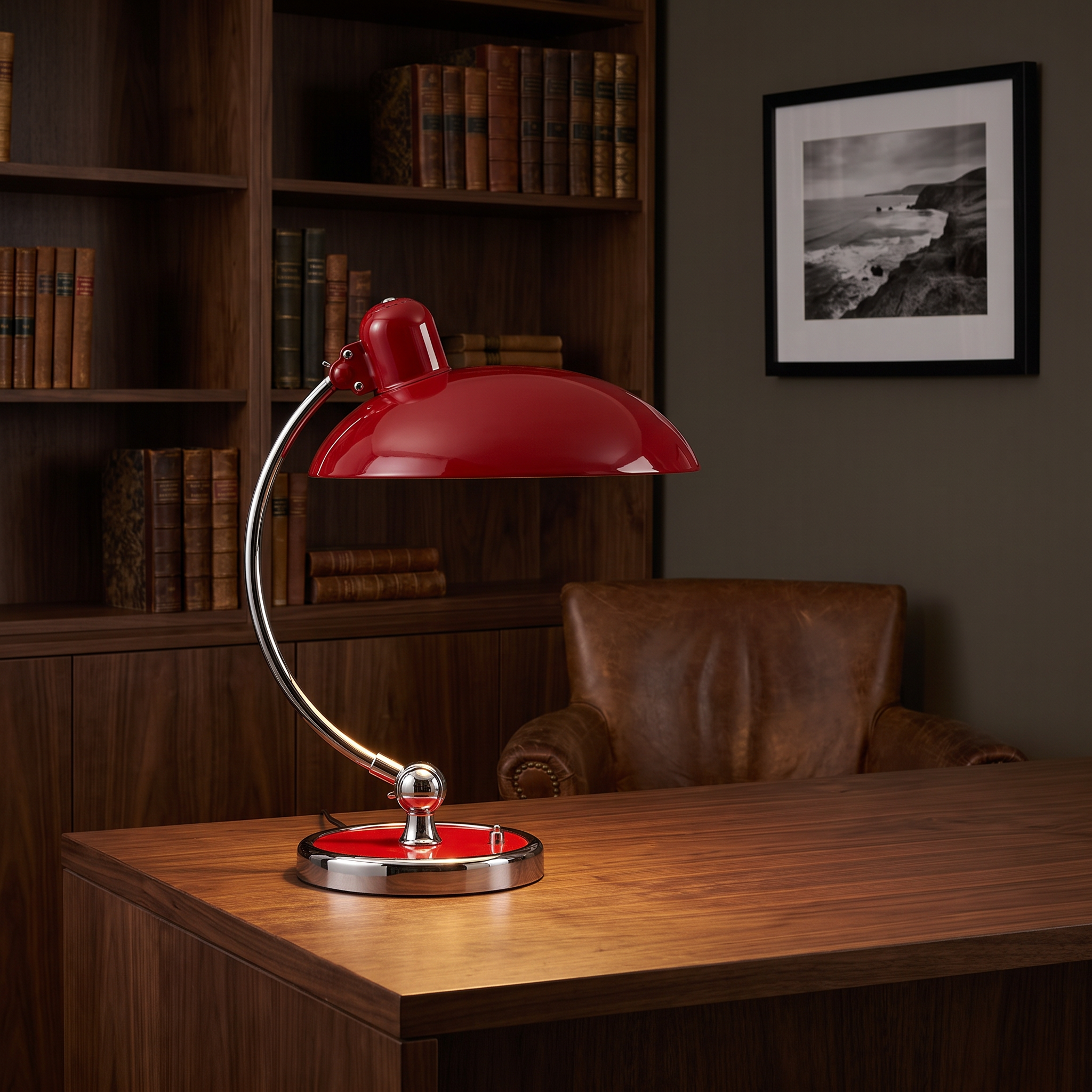 Freya Bauhaus desk lamp in red on a dark walnut desk in a moody, refined study