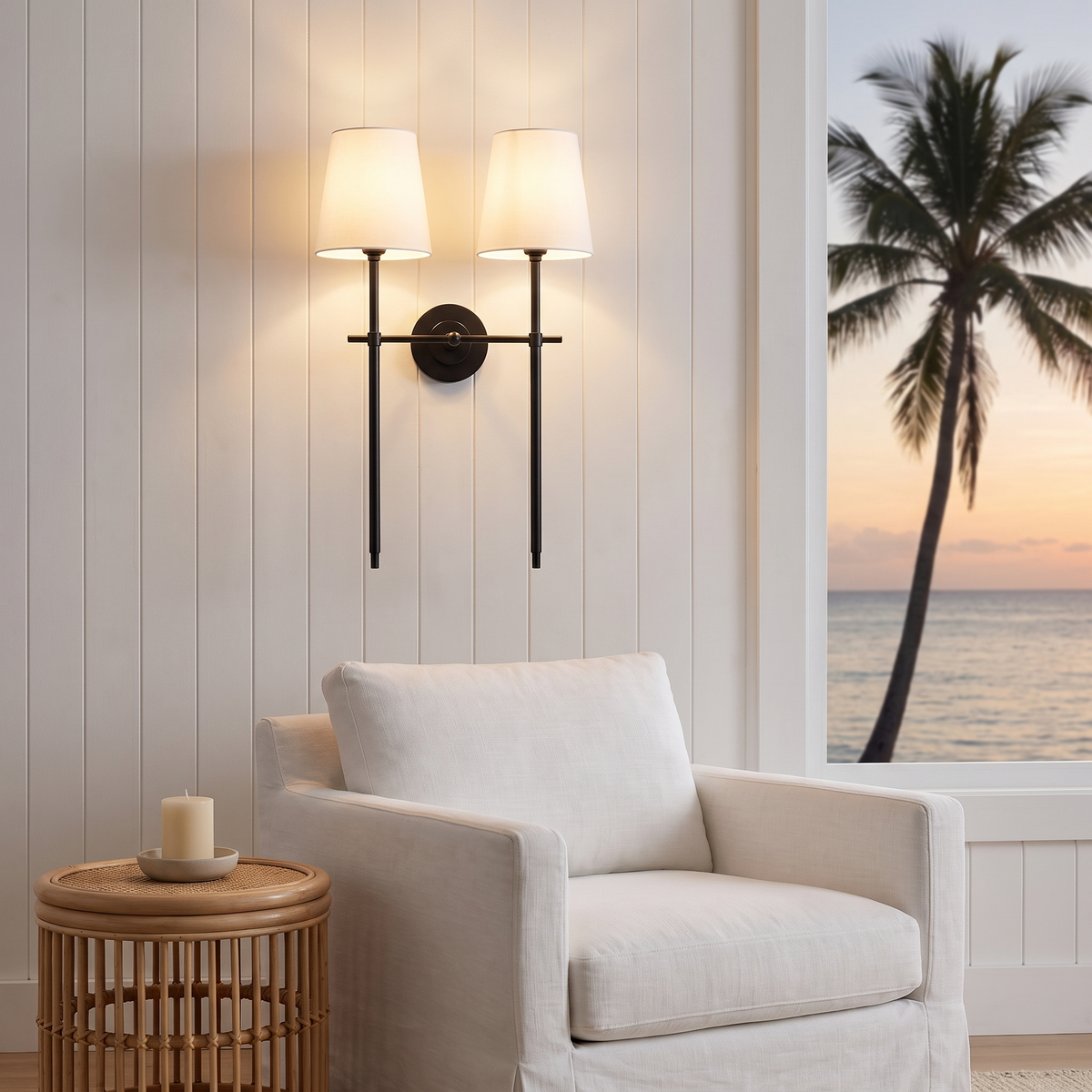 Double Gini black wall sconce with fabric shades above a linen armchair in a beach house