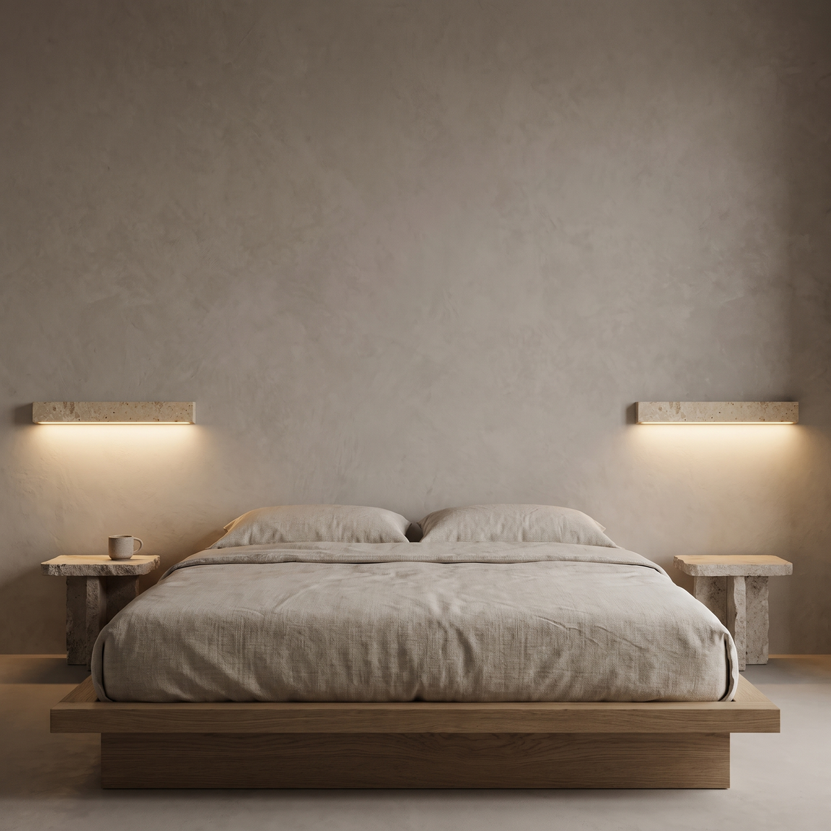 Pair of Guru travertine wall lights above bedside tables either side of an oak platform bed