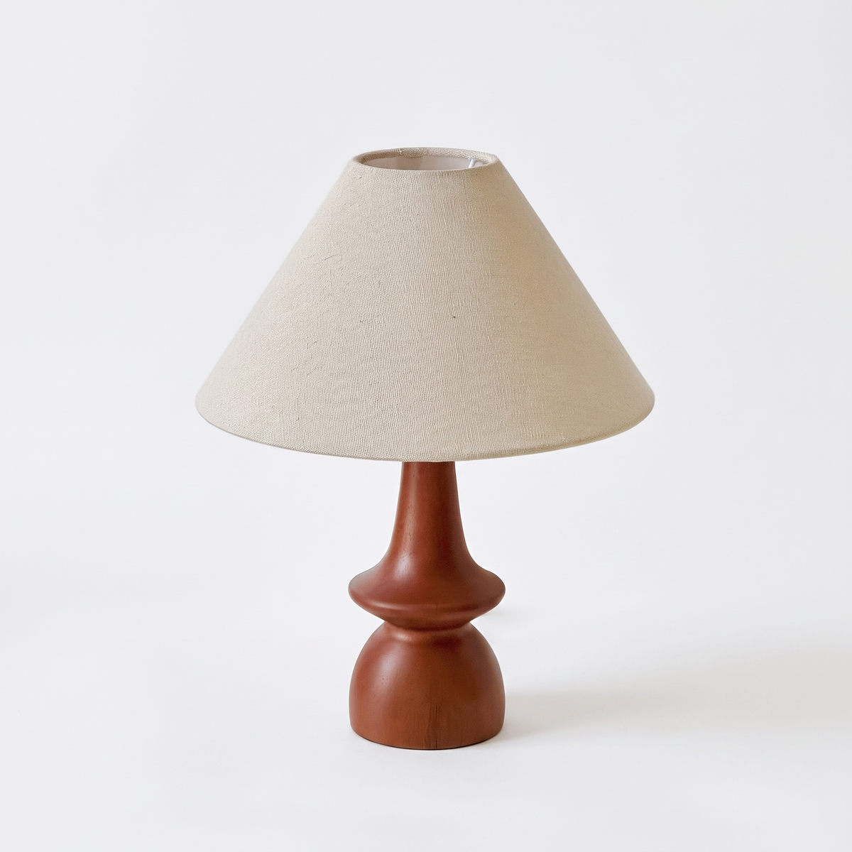 Hawk solid wood table lamp with linen shade on a white background