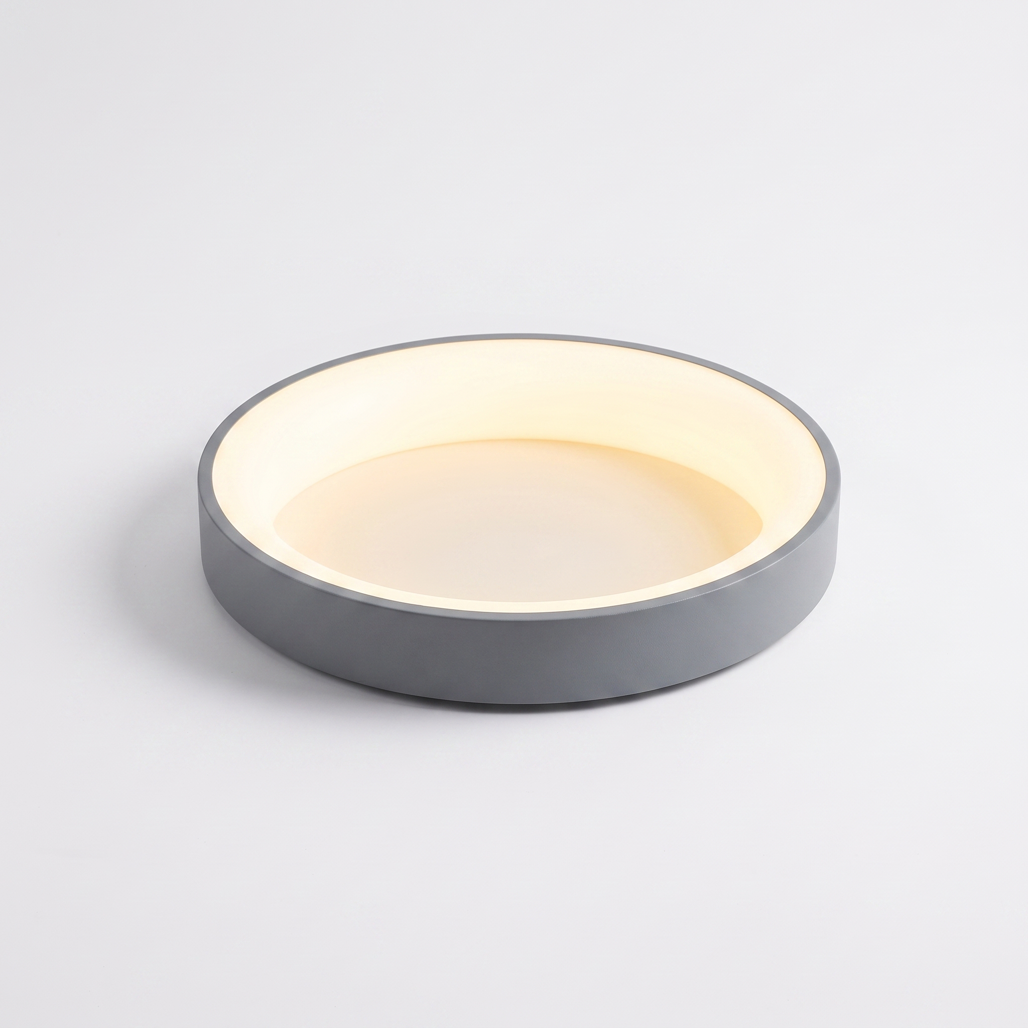 Jilliby LED oyster light in grey on a white studio background