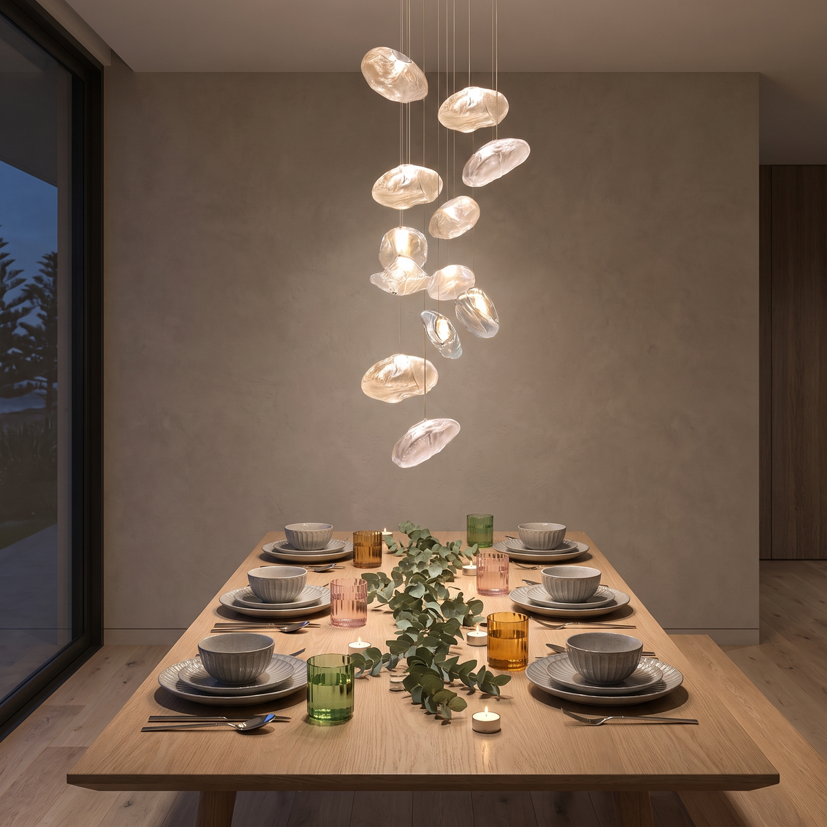 Sumba glass cluster pendant over a holiday dinner table set with Nagano dinnerware, Catalina cutlery and Sorento glassware