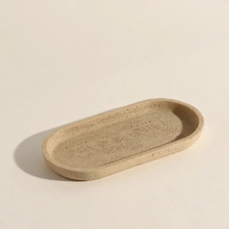 Iven Sandstone accessories styled together on a vanity