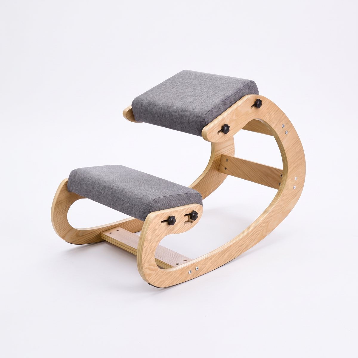 Ivy ergonomic kneeling chair with natural wood rocking frame and grey cushions on a white background