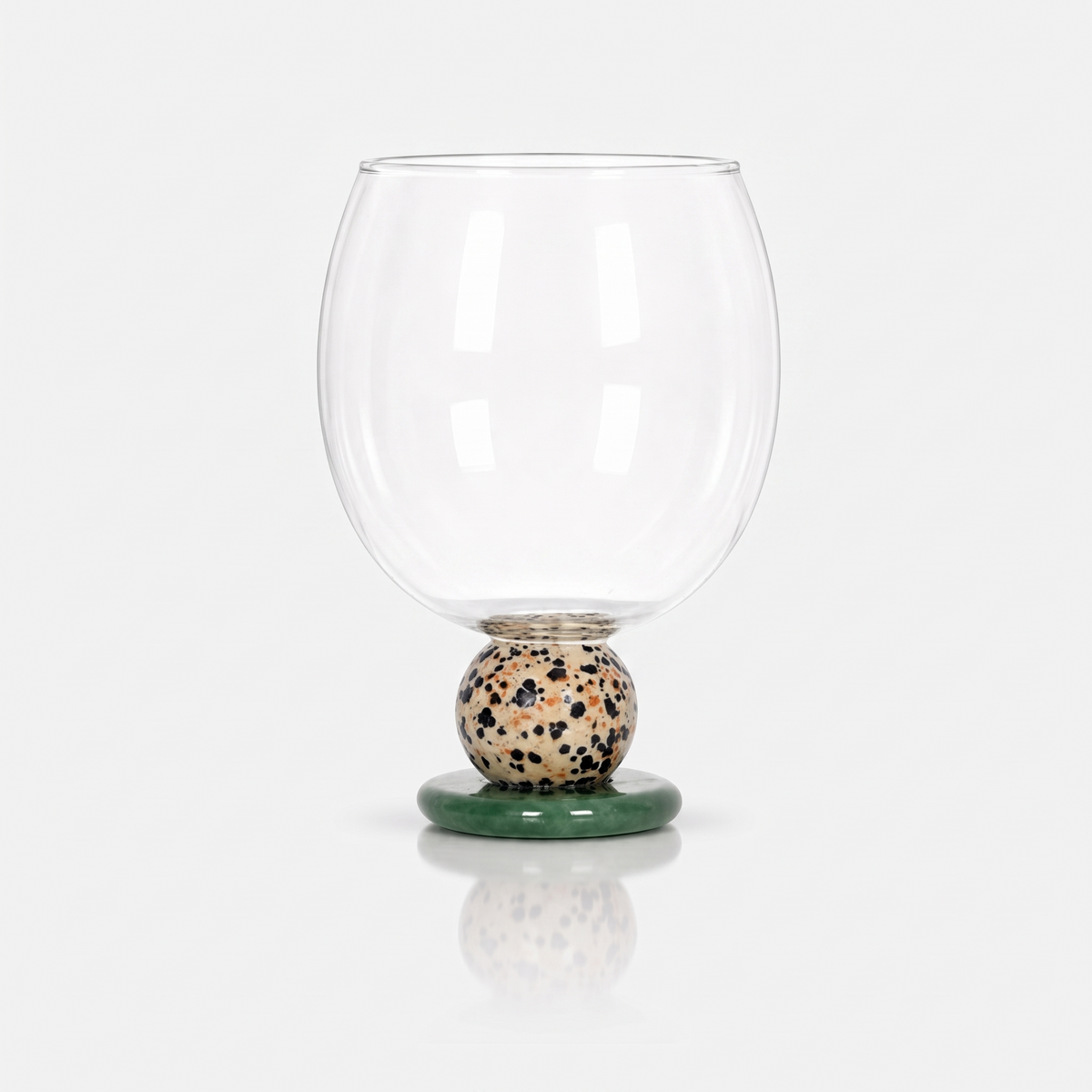 Ivy Sculptural Borosilicate Drinking Glass in Sand on a plain white background