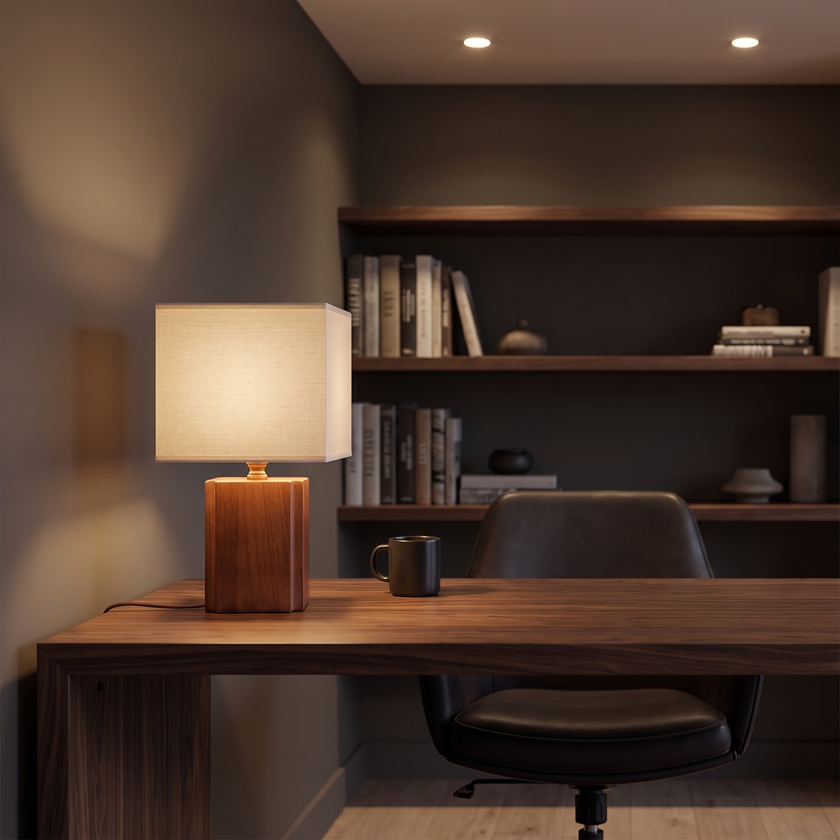 Jiwa wabi-sabi bamboo table lamp glowing on a walnut desk in a home study