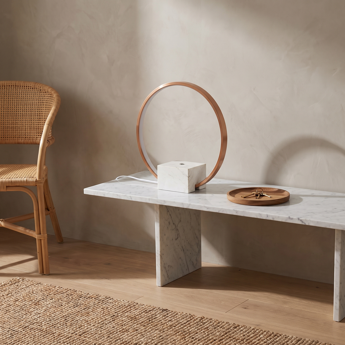 Juli marble table lamp with copper accents on a marble console in a Japandi entry
