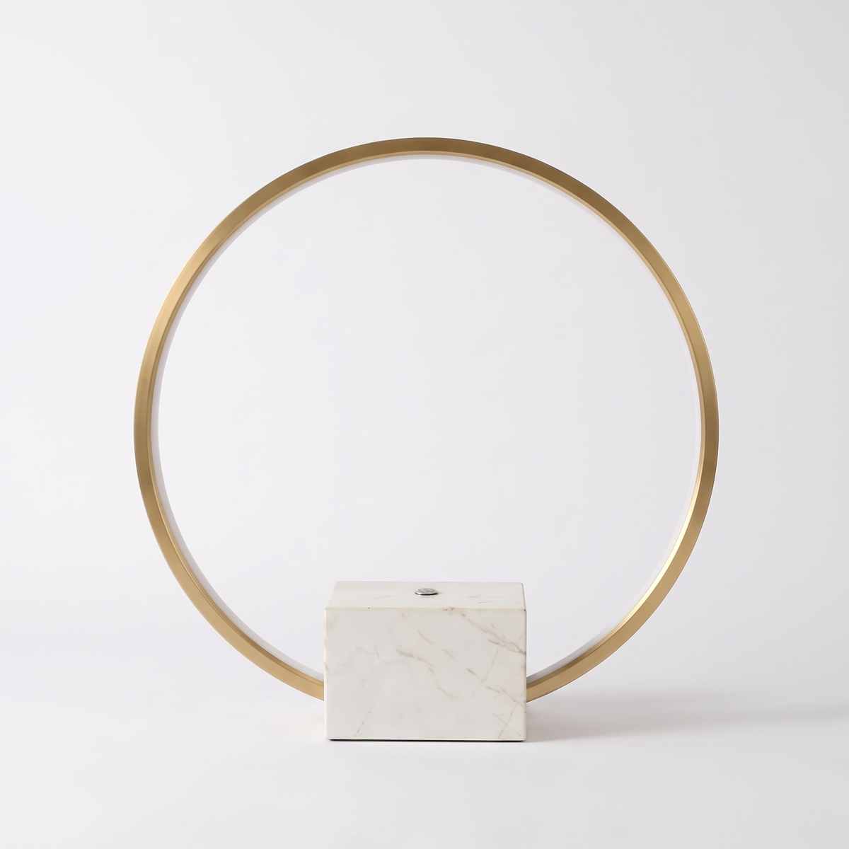 Juli marble table lamp with copper halo on a white background