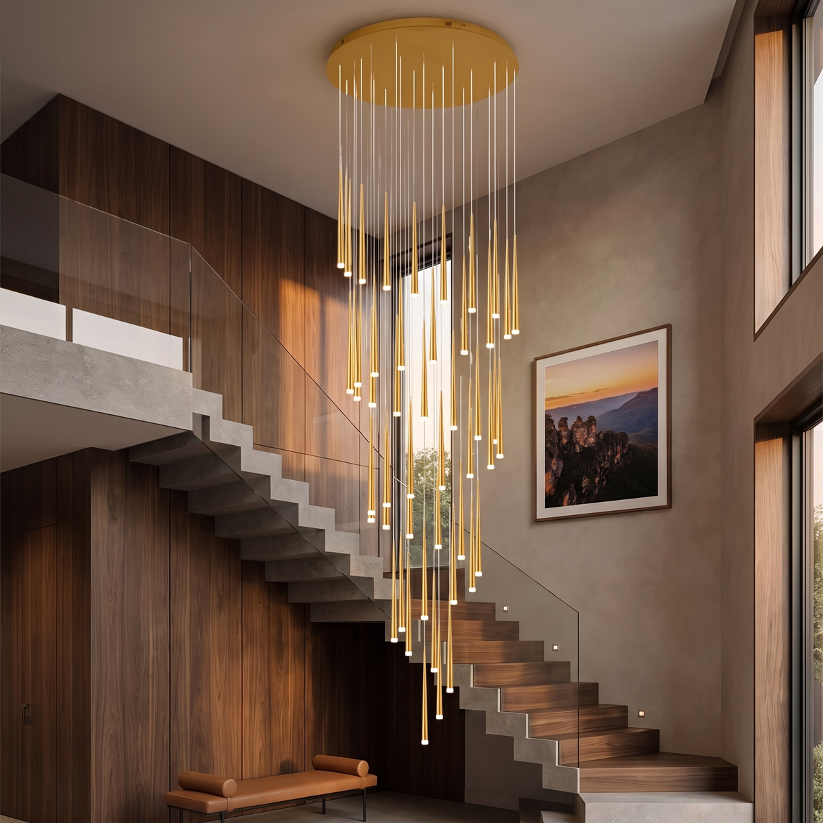 Gold Jundaru pendant light hanging in a walnut-panelled stairwell at dusk
