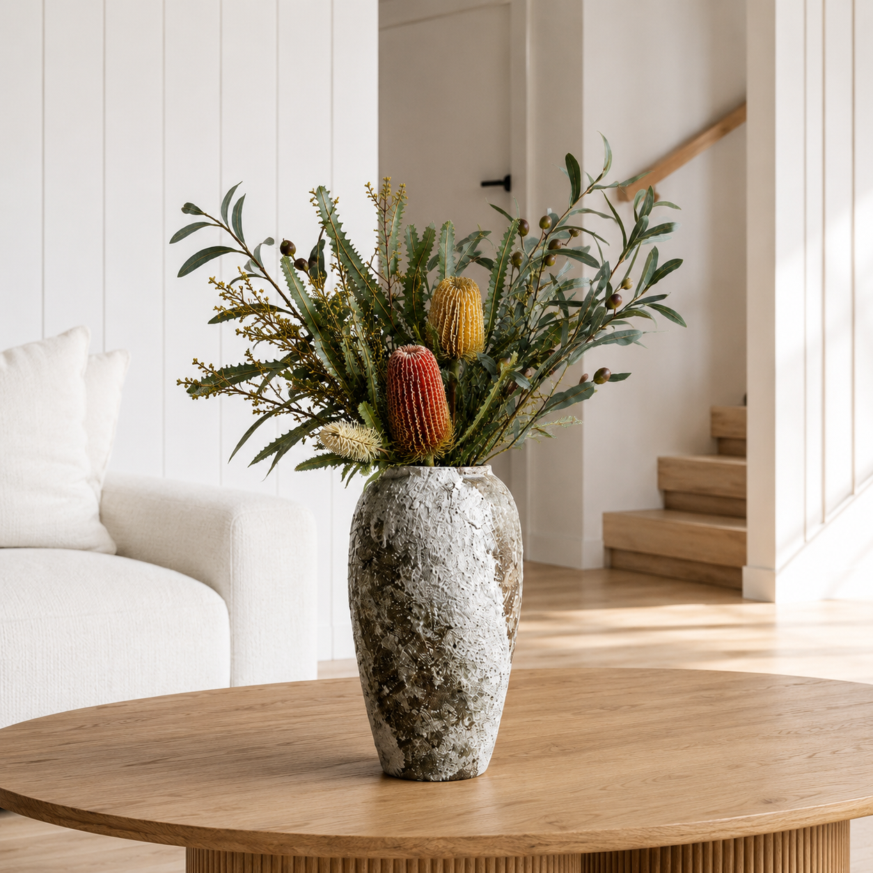 Keramas Ceramic Vase displayed on a shelf, showcasing its stone-inspired finish