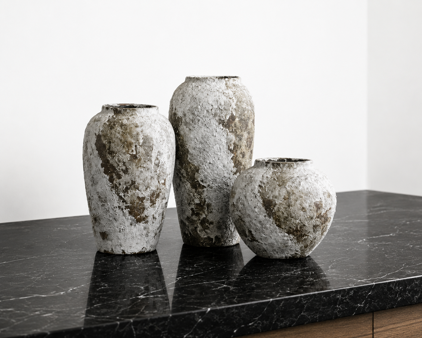 Keramas Ceramic Vase styled with fresh flowers on a dining table