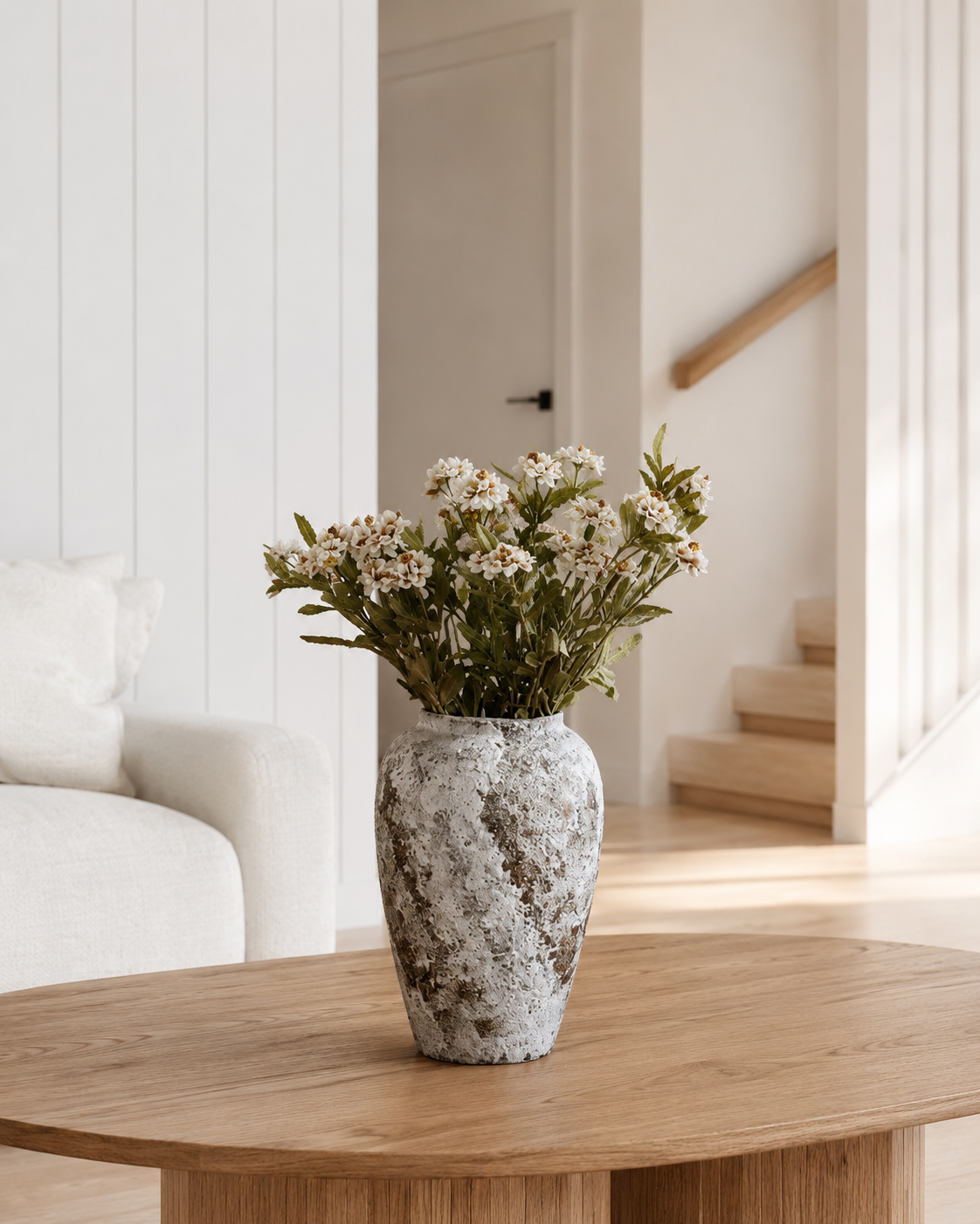Keramas Ceramic Vase in the Round shape displayed in a living room setting