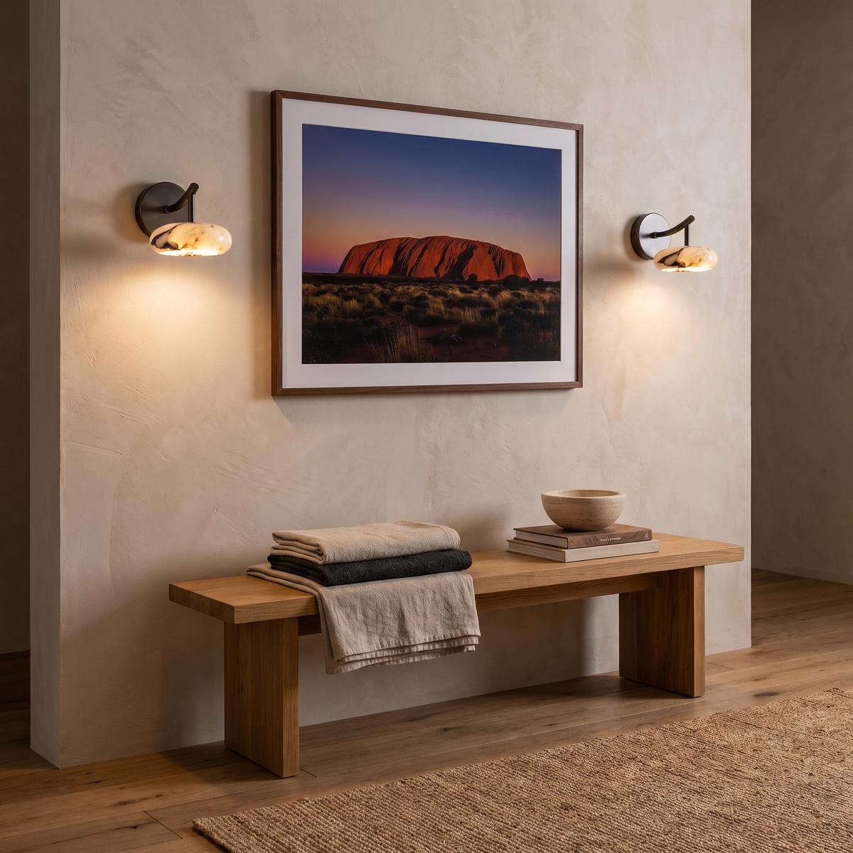 Kongs marble wall sconce either side of an Uluru print in a Scandinavian living room