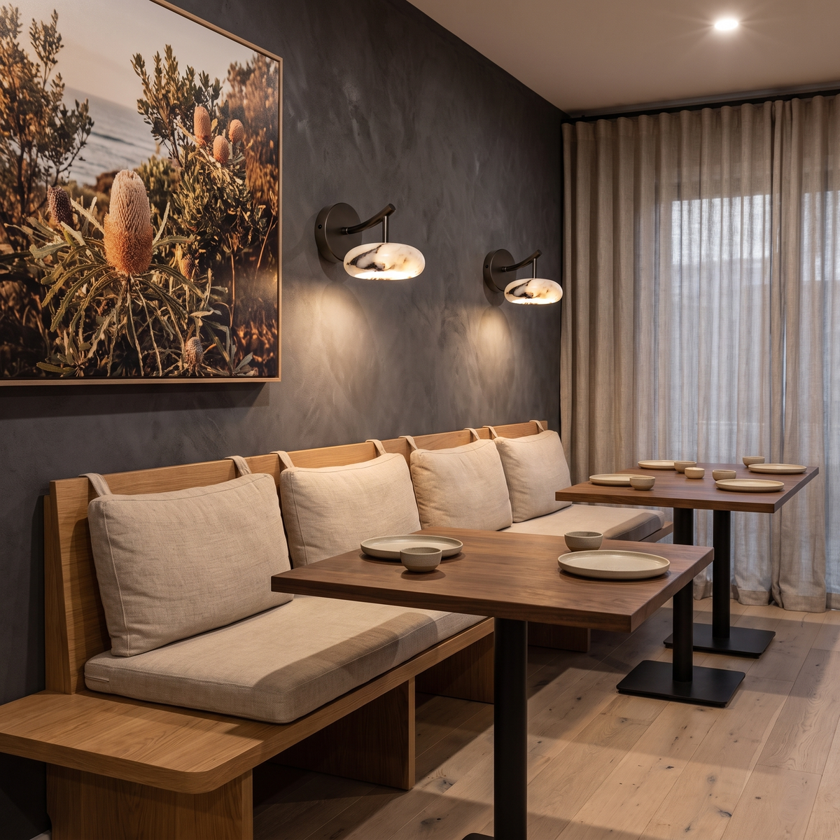 Kongs marble wall sconce above booth seating in a Japanese-Australian restaurant