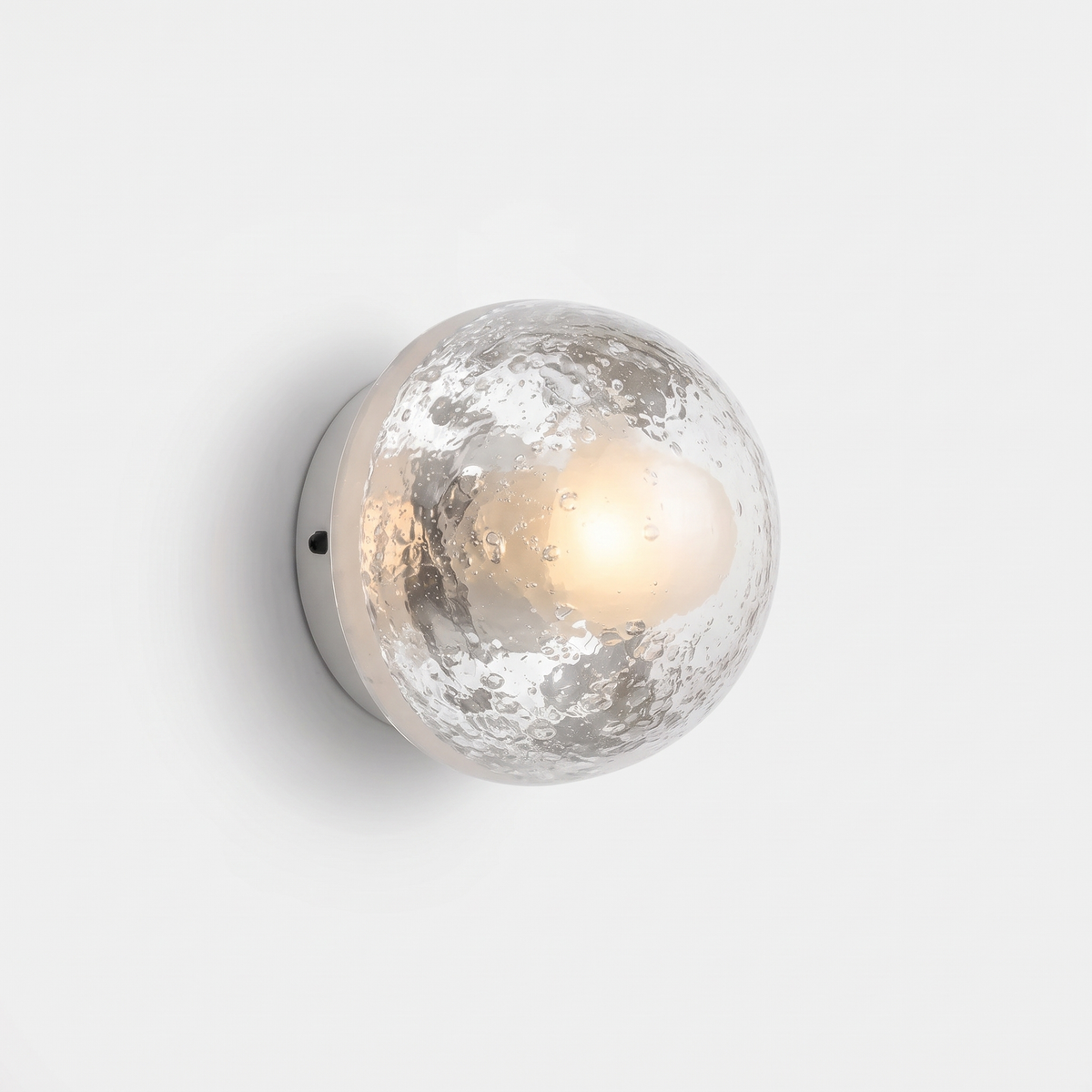 Larry wall sconce with a clear bubble glass dome on a white background