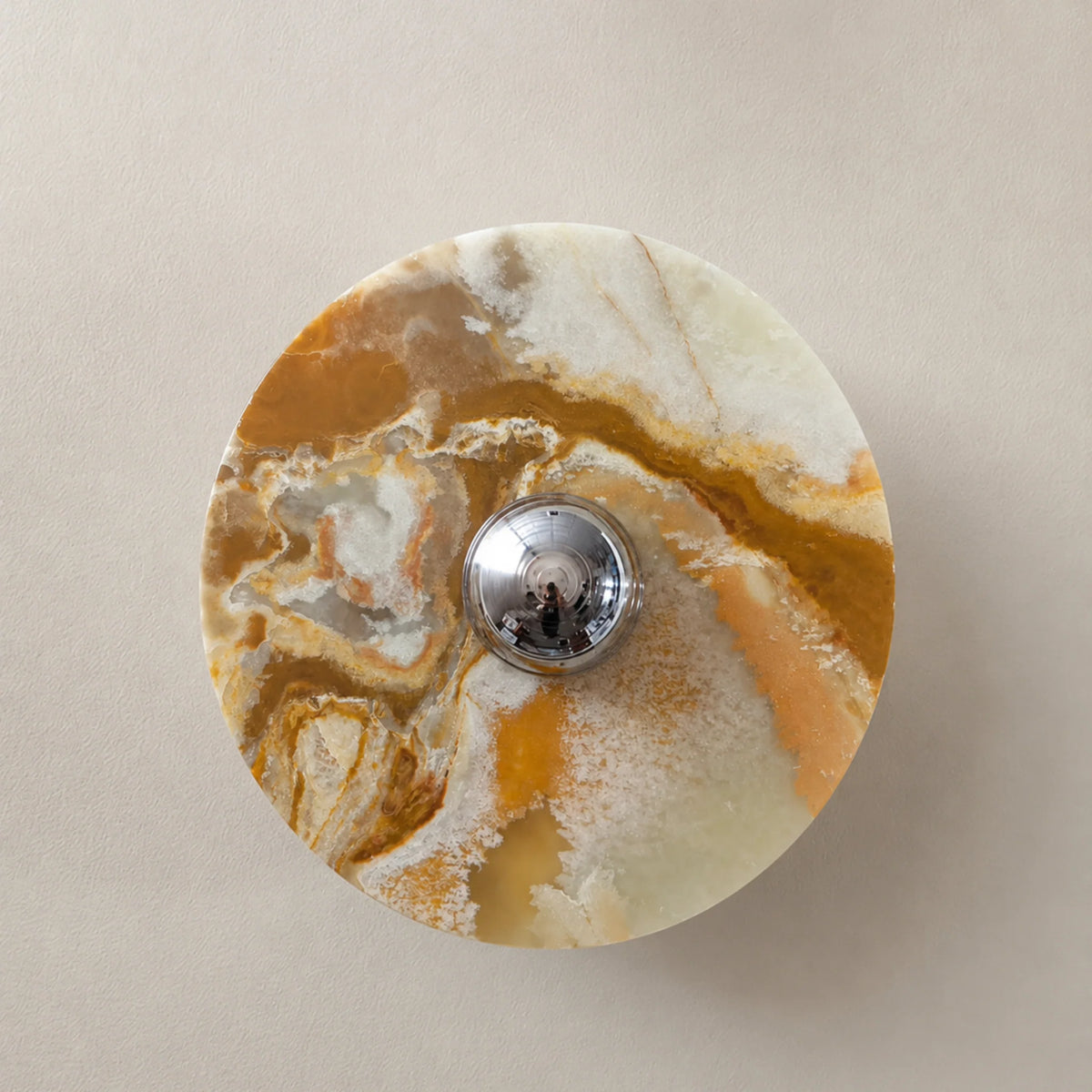 Lias jade onyx wall sconce with warm amber and cream stone veining and a chrome centre cap