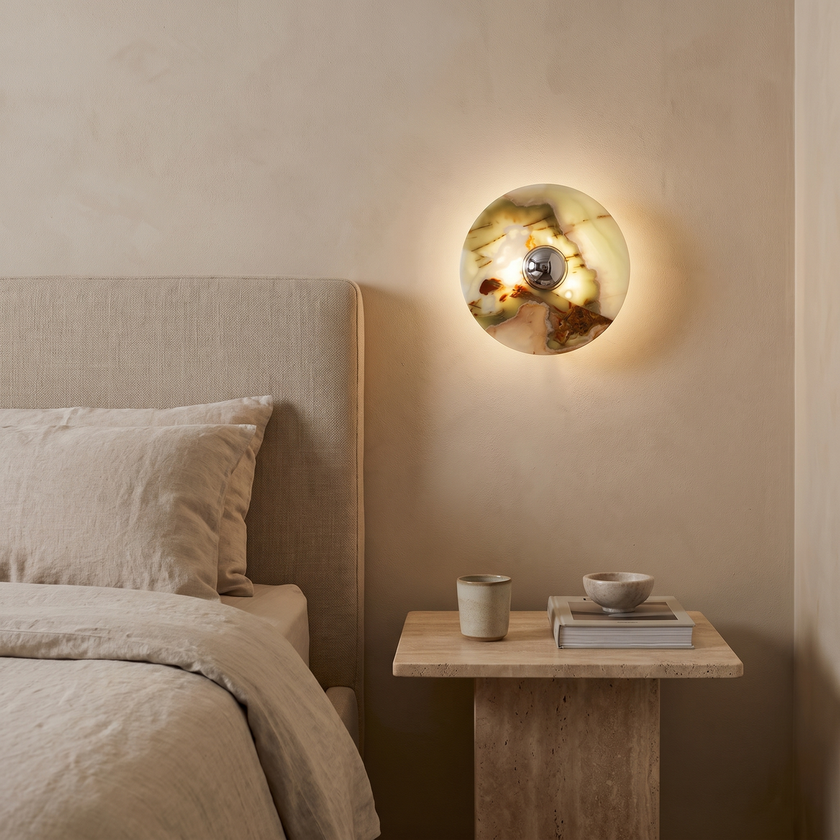 Lias jade onyx wall sconce in a bedroom