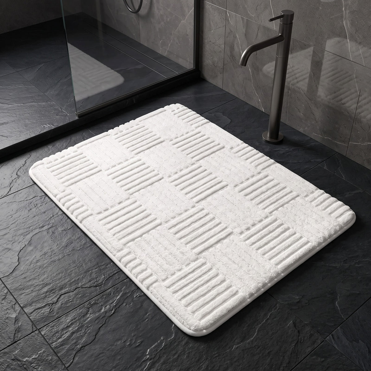 Marden striped non-slip bath mat in white on a slate floor outside a walk-in shower