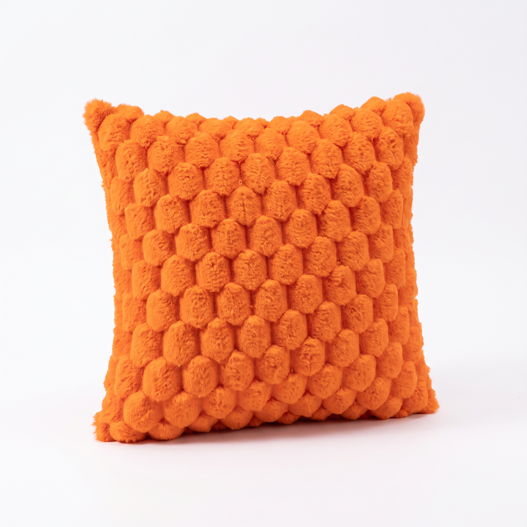 Maria plush 3D textured cushion cover in orange on a white background